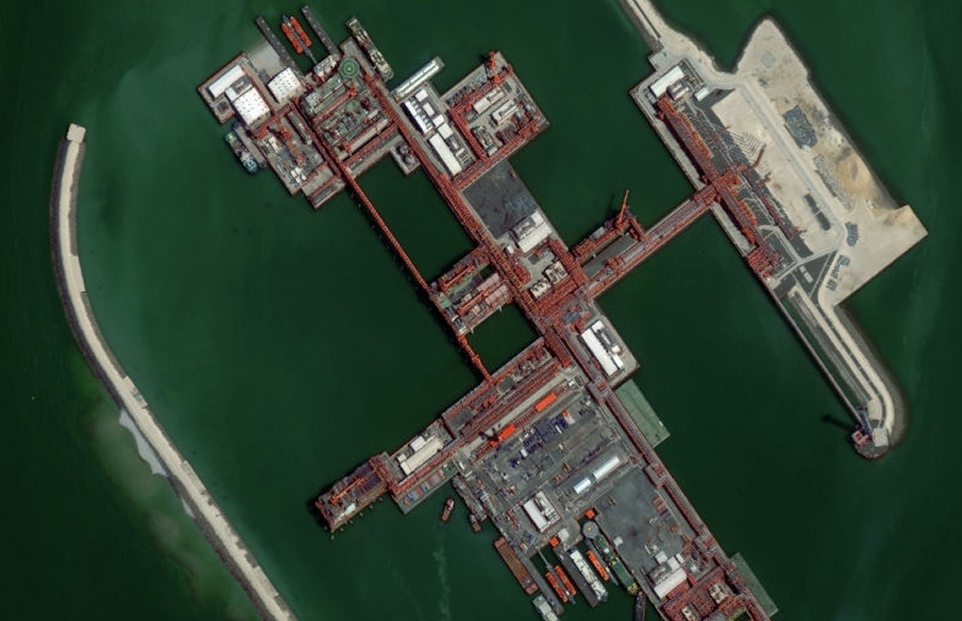 Satellite view of the Kashagan Field, a large offshore oil and gas development with artificial islands and connecting infrastructure in the Caspian Sea.
