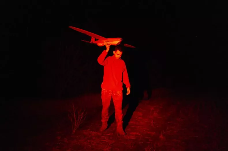  A man holding a drone